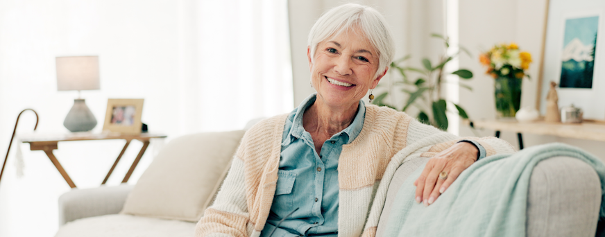 Life Assure Senior Woman Sitting In Chair And Laughing With Caregiver Nurse Hero